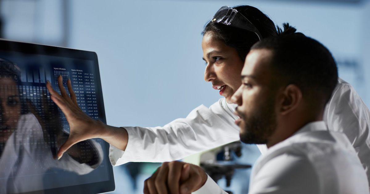 Two doctors looking at computer screen